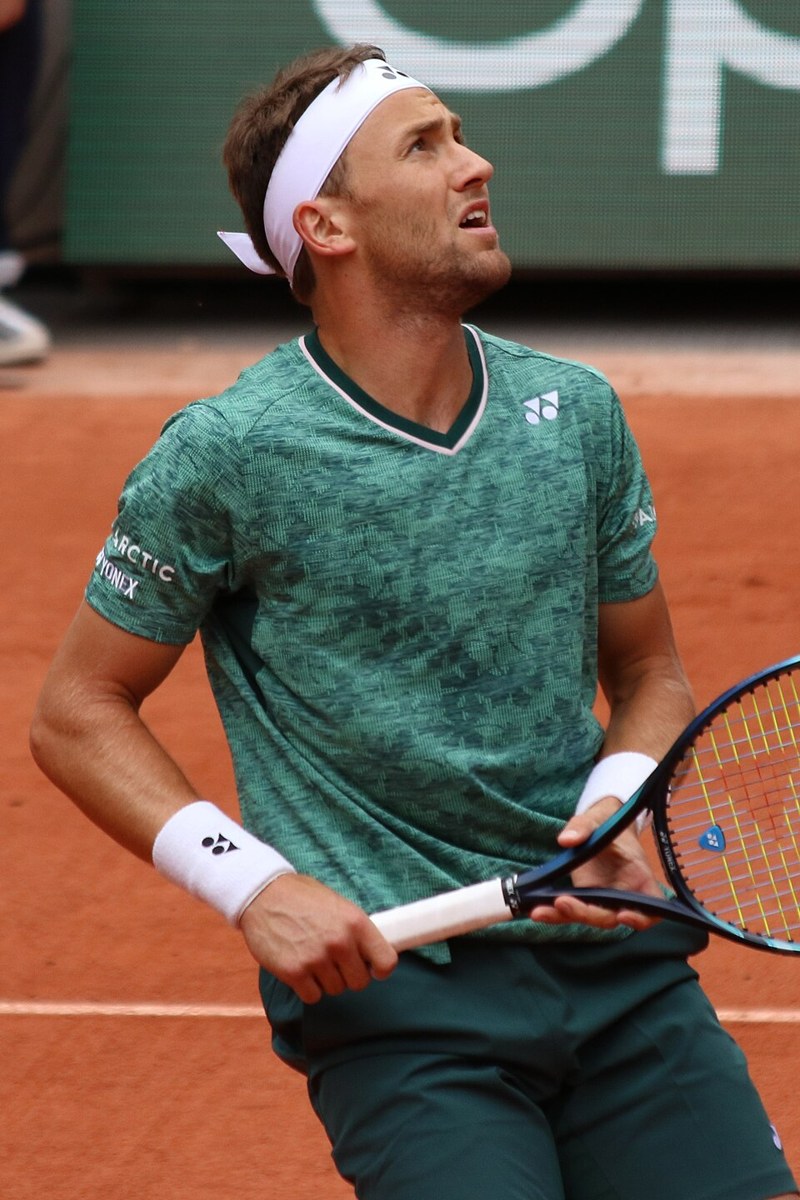 Casper Ruud playing tennis at a Grand Slam tournament