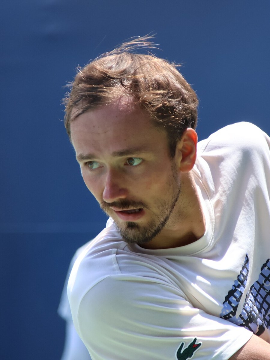 Daniil Medvedev playing tennis at a Grand Slam