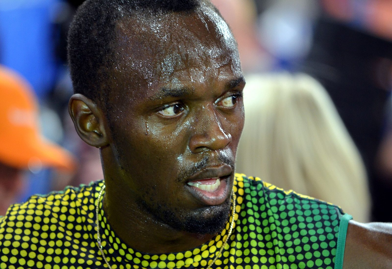Usain Bolt celebrating victory with his signature lightning pose