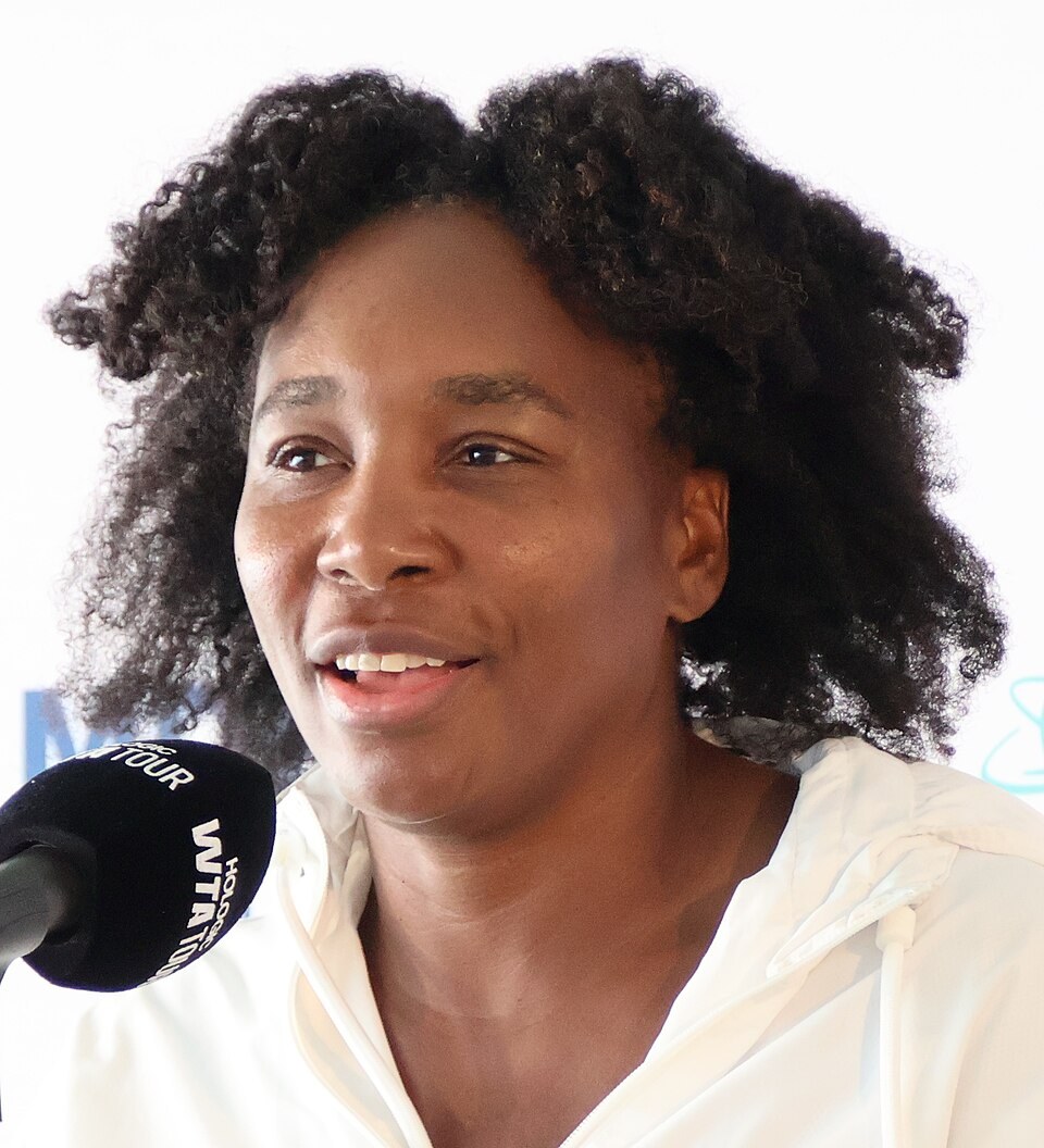 Venus Williams playing tennis at a Grand Slam tournament