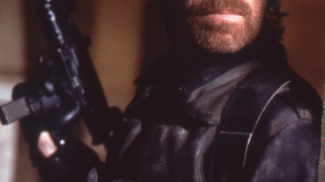 Chuck Norris in his classic martial arts pose from his action film heyday