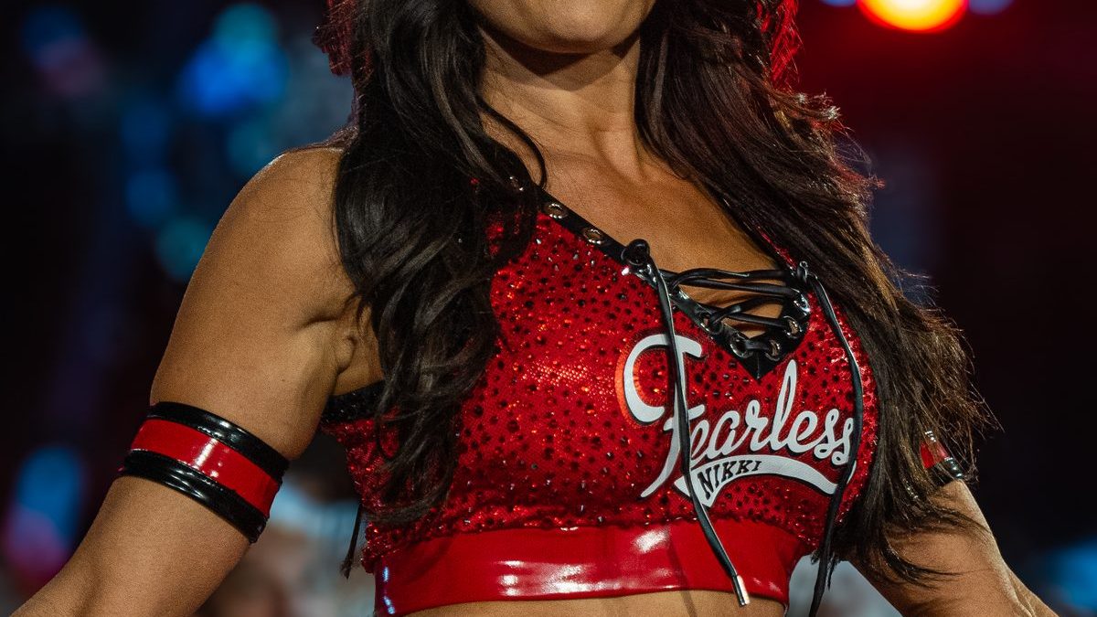 Nikki Bella posing at a WWE event in athletic attire