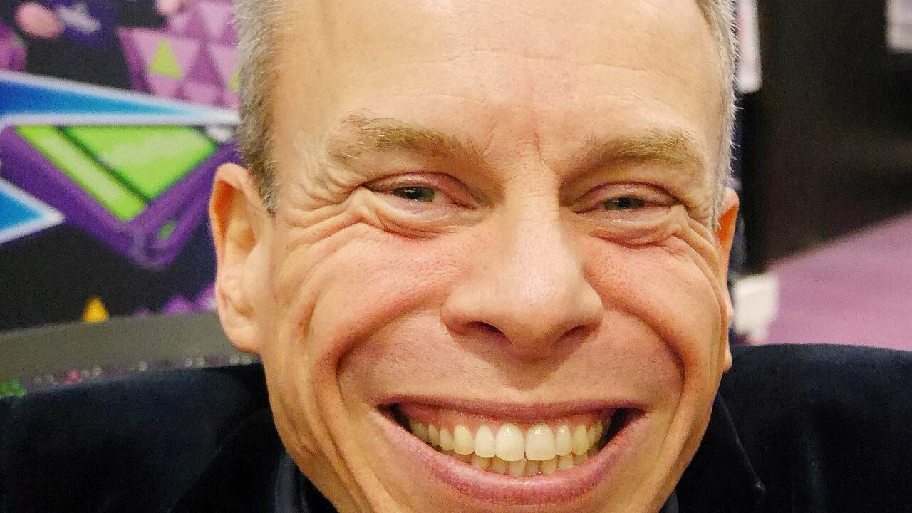 Warwick Davis then and now profile photo