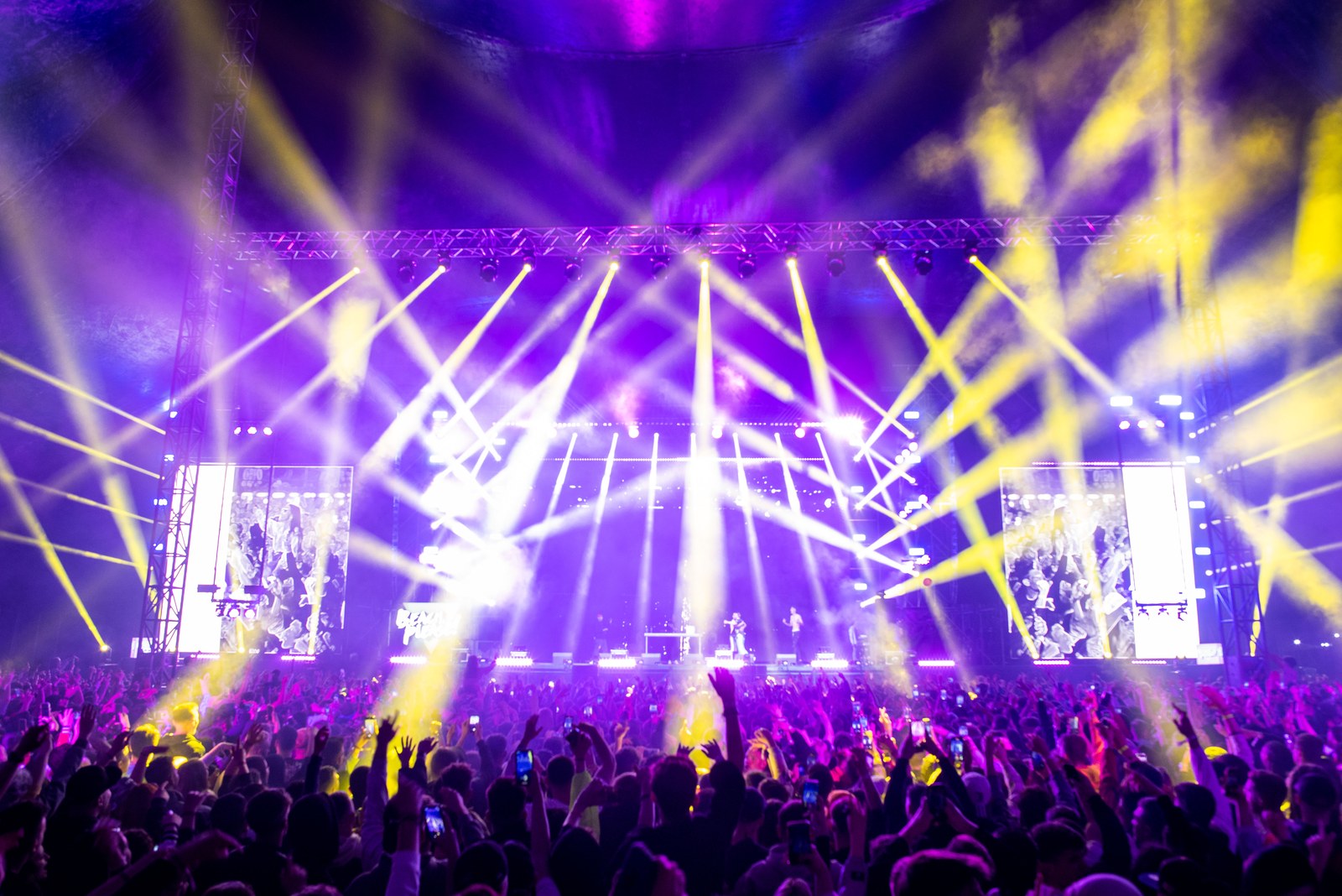 Thematic illustration: a concert stage with lights and crowd