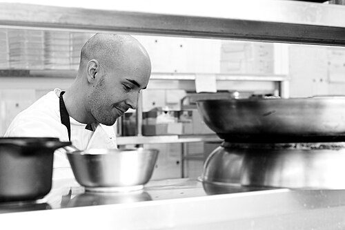 Illustrative photo of a chef at work in a kitchen; Jeremy Miller is a trained private chef (not a photo of Miller himself)