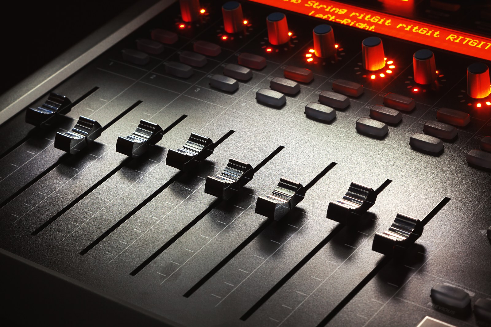 Thematic illustration: a modern music mixing console
