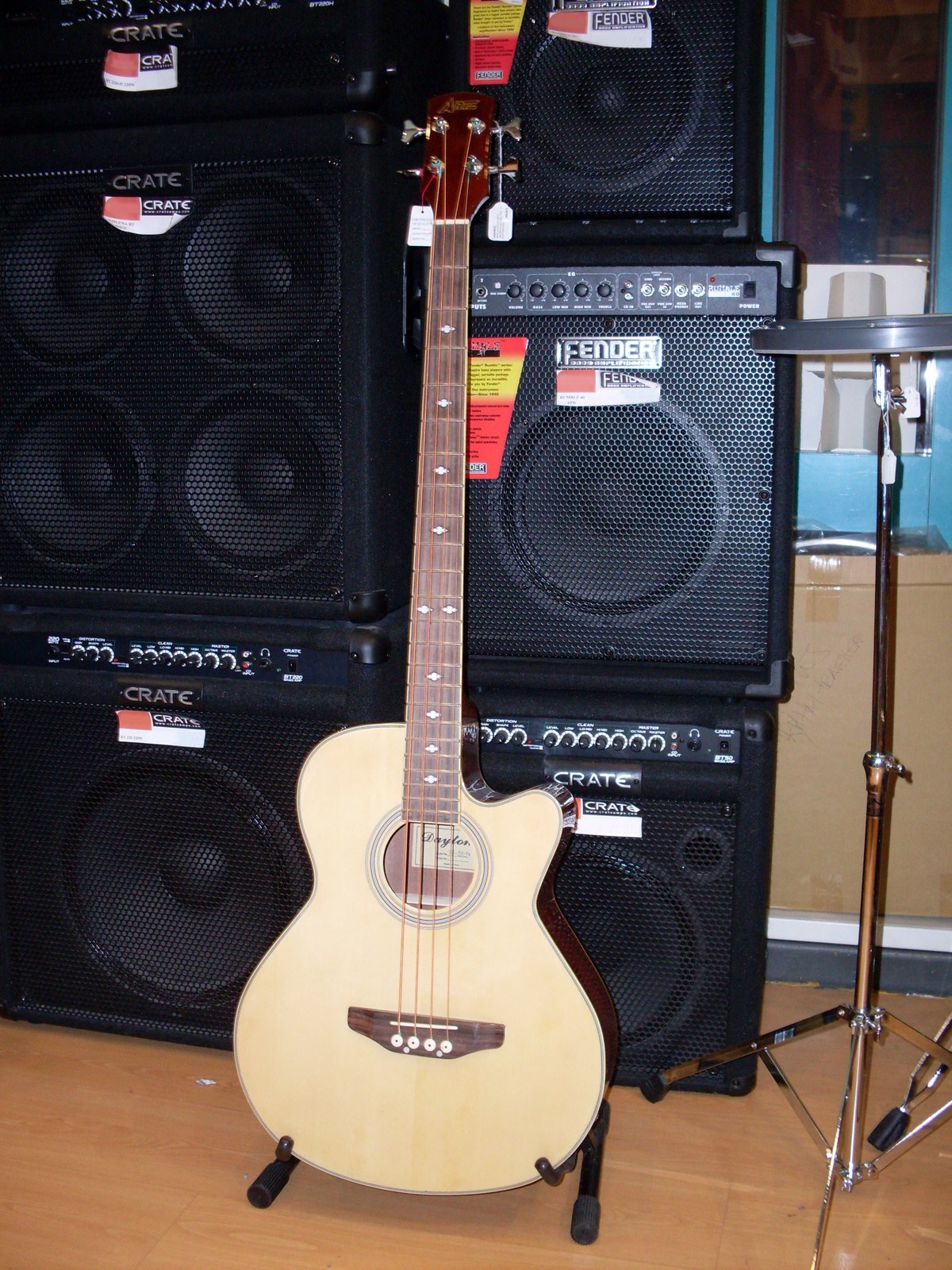 Thematic illustration: an acoustic bass guitar on a stand