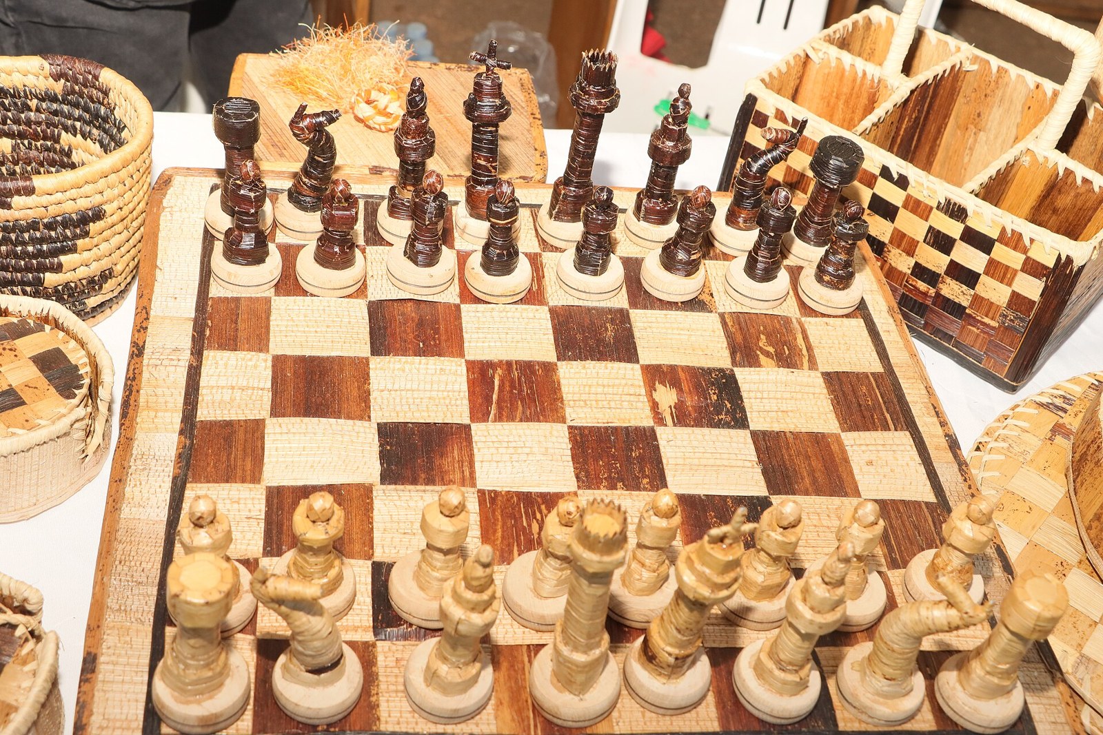 Thematic illustration: chess pieces on a board in dramatic light