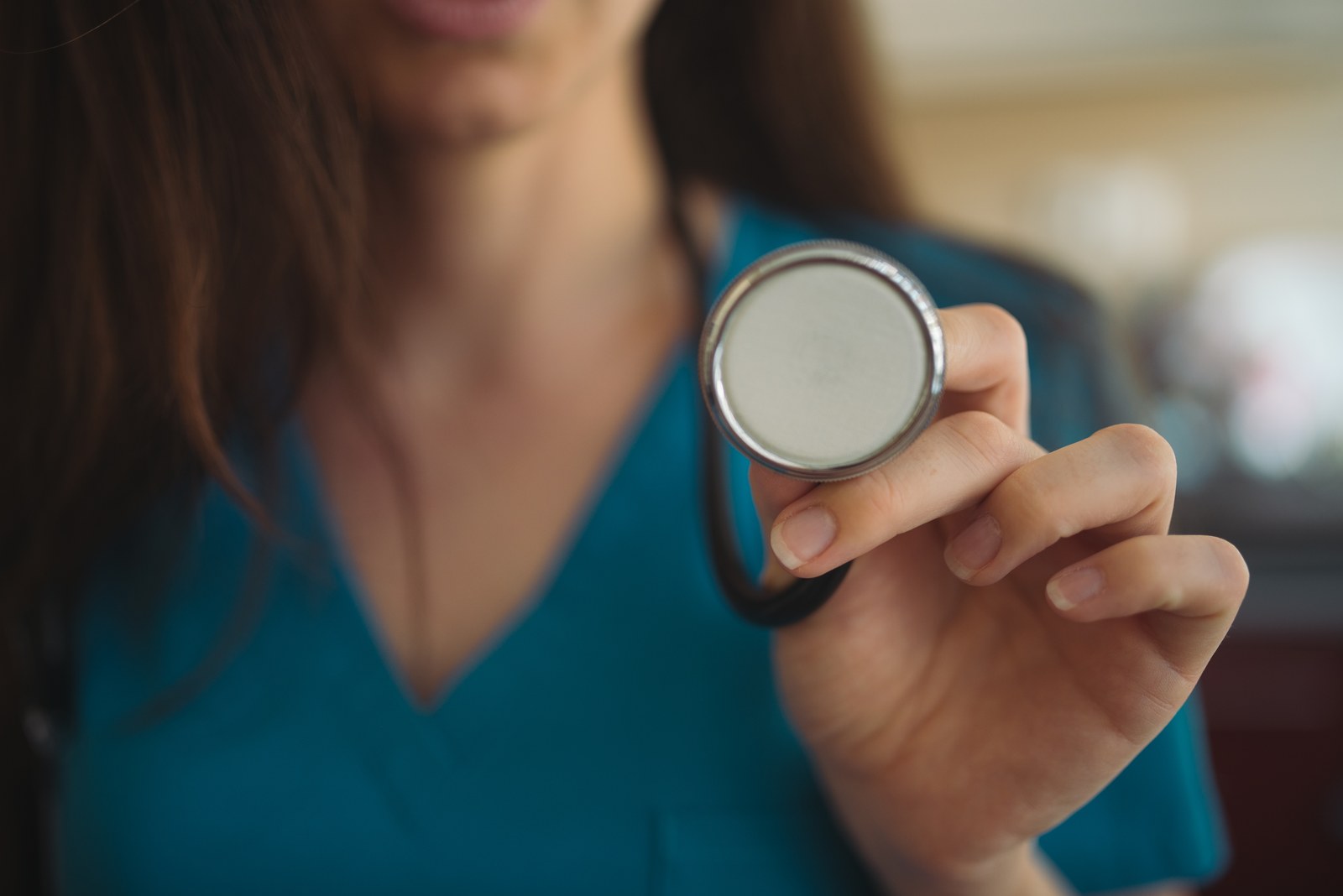 Thematic illustration: a nurse holding a stethoscope