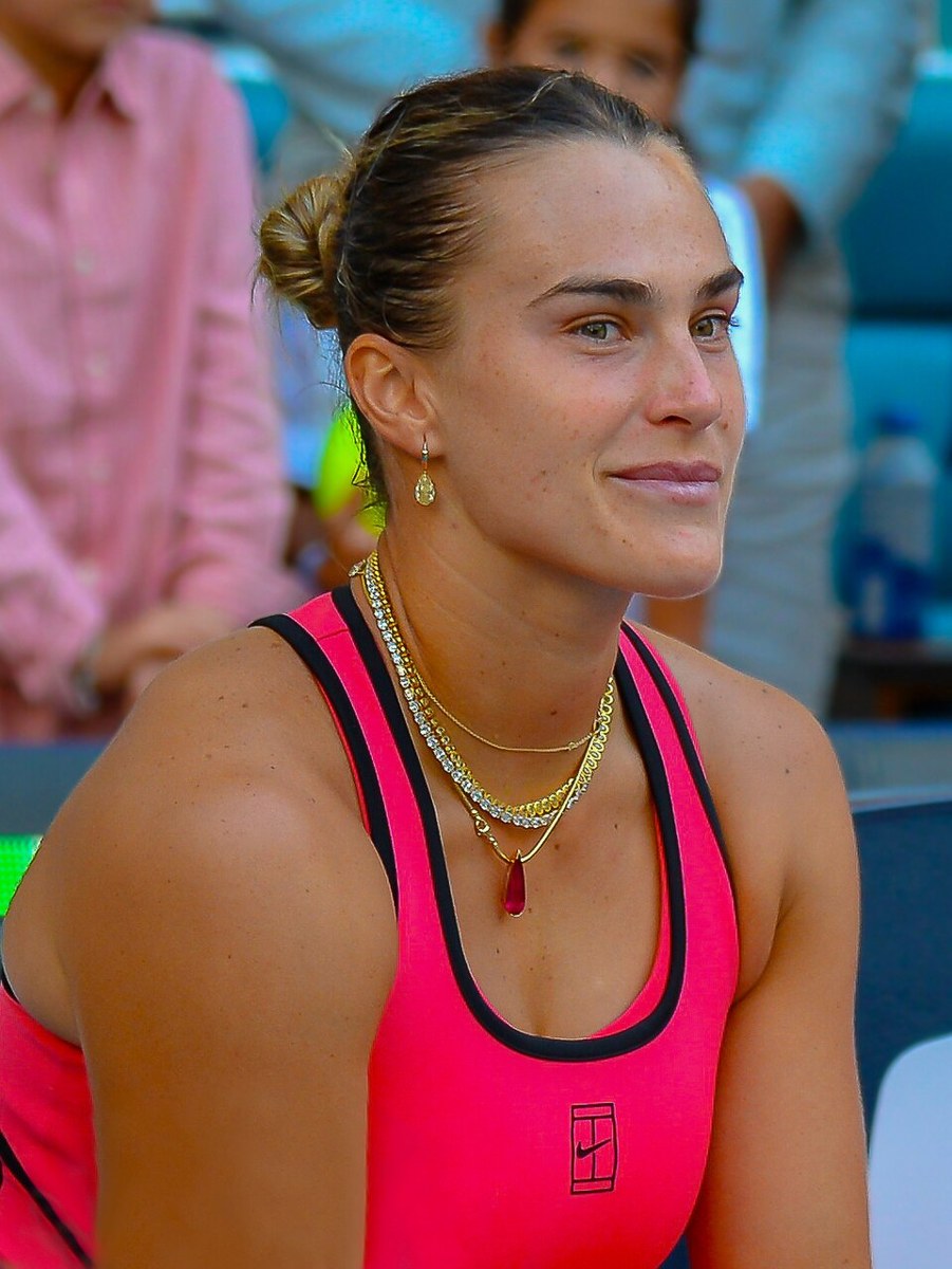 Aryna Sabalenka celebrating a match win on court
