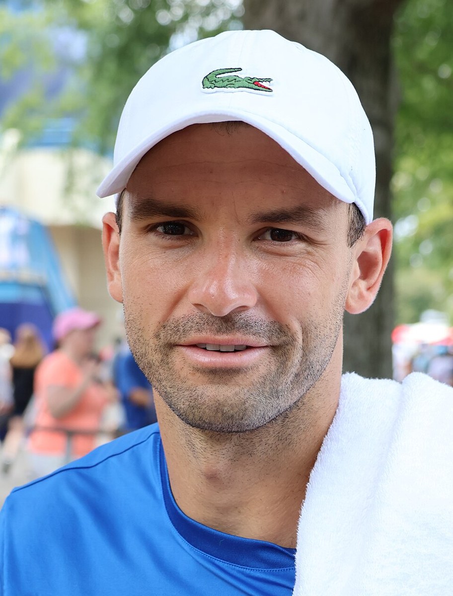 Grigor Dimitrov playing tennis at a tournament