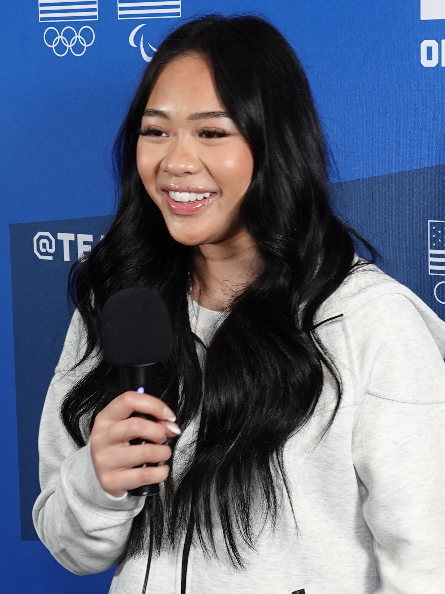 Suni Lee speaking at a Team USA media event